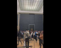 Tourists Take Pictures of Mona Lisa Paint
