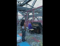 Guy plays piano on bridge 