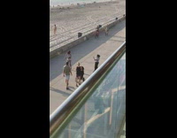 Woman white bikini tiktok dance middle of the street