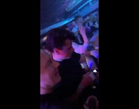 Guy at club playing puzzle game on apple watch