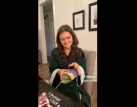 Girl opens card with cash in it 