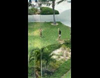 Woman in bikini stripes kneels resort grass