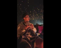 Guy knitting stops run away lantern for woman 