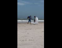 Woman mermaid costume sits on inflatable seashell Part 2