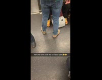 Womans shoes sneakers looks like krabby patty hamburger on subway train