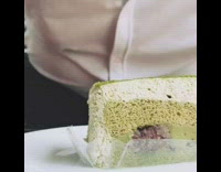 Guy takes bite green cake