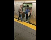 group moves mattress wrapped in blanket