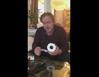 Guy smoking a cigarette indoors gives advice