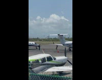 Woman Skips Toward Camera next to Jet 