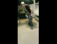 Boy tries to flip on a skateboard and falls backwards, wallet falls out of pocket