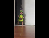 Toddler girl wears avocado costume 