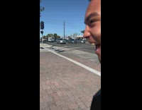 Guy presses crosswalk button with butt 