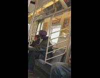 Black jacket guy smokes cigarette inside train 