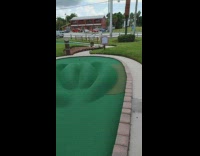 Toddler boy gets hole in one mini golf 
