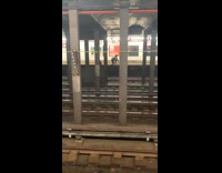 Collab winy - Two people cross the subway train tracks