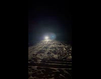 ATV drives fast on sand 