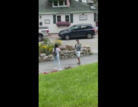 Girl white shirt jump grass flowers backpack