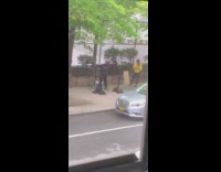 Guy squats lifts weights rack sidewalk 