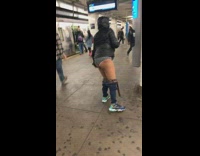 Woman walks around subway station in underwear