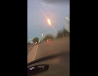 Woman hits curve driving while filming