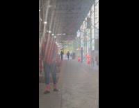 Spiderman injured walks rough on the street