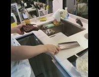 Guy startles cat in sink knife cleaver 