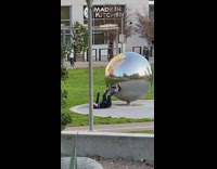 Girl lays on ground outside for photo 
