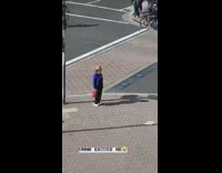 Older couple taking picture at beach