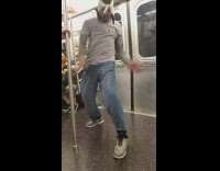 Guy kicks subway doors with the back of his feet