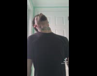 Guy dances with head and neck 