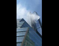 Water shoots out from high rise building 