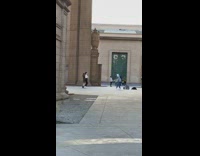 Girls dance in courtyard 