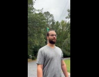 Man with windmill toy on hair bun