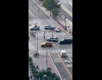 Police car falls into sinkhole on road