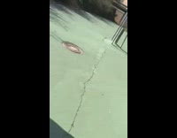 Shirtless guy skateboard tricks green paint ground 