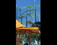 Maintenance Men Push Stuck Rollercoaster Car on Track