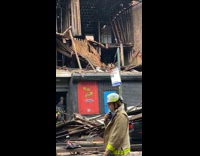 Heavy wind tears wall off building firefighters 