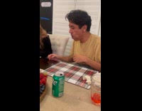 Man does chubby bunny using green grapes 