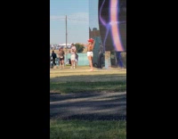 Woman red cowboy hat poses at concert