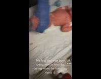 Newborn baby boy stops crying when dad holds hand 