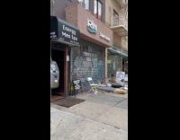 Guy sleeps on mattress on ground outside 