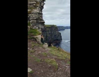 Collab IITW - Woman green dress video shoot near cliff