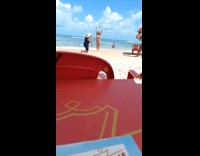 Guy straw hat direct woman jump beach