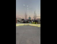 Girl blue pants dance green plant boxes