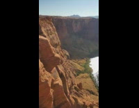 Three girls pose cliff edge pink dress 