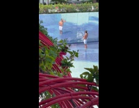 Guy white shorts public fountain wall mirrors