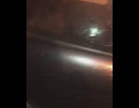 guy in grey inside car throwing up in bucket 