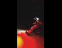 Selfie stick video of guy snowboarding at night