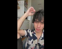 Guy with white swan shirt wet hair