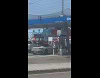 Woman dress take selfie beside car gasoline station